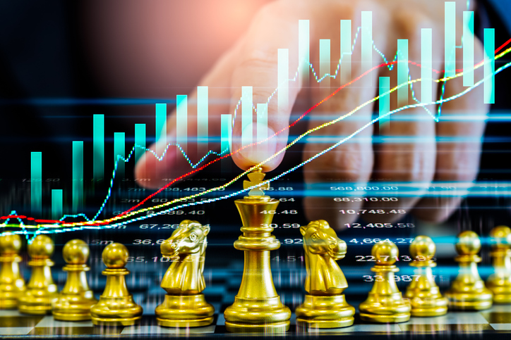 Chess game on chess board on stock market or forex trading graph chart for financial investment concept. Economy trends for digital business marketing strategy analysis. Abstract finance background.